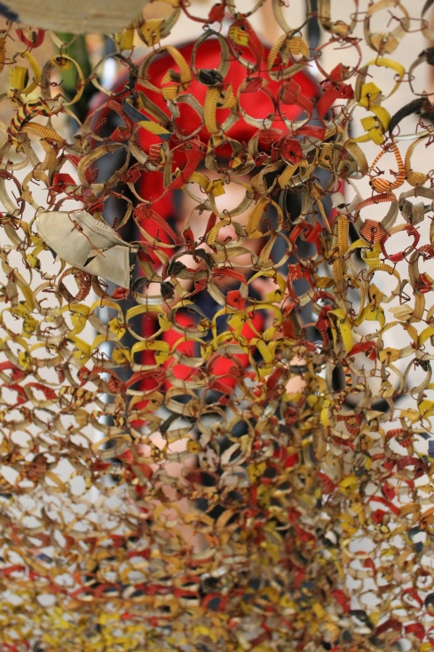 Looking through "Gravity and Grace", work by El Anatsui
